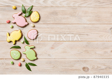 holiday preparation Multi colors Easter eggs with cookies on colored background . Pastel color Easter eggs. holiday concept with copy space 87940335