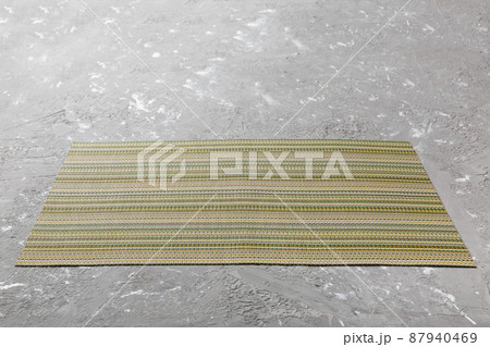 Perspective view of tablecloth for food on cement background. Empty space for your design 87940469