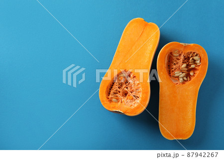 Raw pumpkins on blue background, top view Raw pumpkins on blue background, top view 87942267
