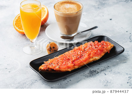 Traditional Spanish breakfast. Tostada with different toppings on a light background 87944437