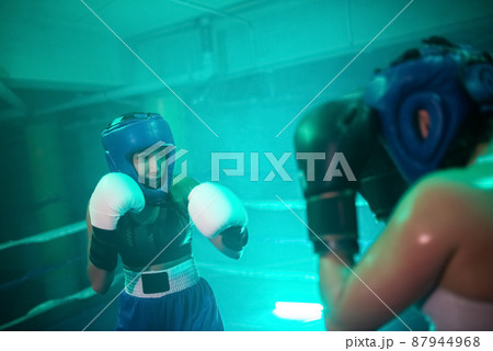 Close-up of boxer girls during active sparring in gym 87944968