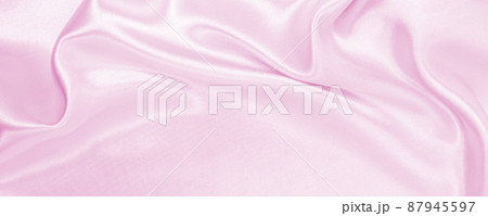 Smooth elegant pink silk or satin texture as wedding background. Luxurious background design Smooth elegant pink silk or satin texture as wedding background. Luxurious background design 87945597