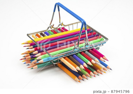 set of colored pencils for drawing in a basket from the market. set of colored pencils for drawing in a basket from the market. 87945796