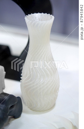 Objects printed on a 3d printer made of white plastic close-up. Objects printed on a 3d printer made of white plastic close-up. 87945842