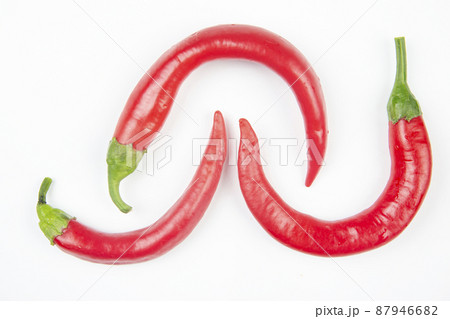 Red hot chili peppers on a white background. food figures. Vitamin vegetable food Red hot chili peppers on a white background. food figures. Vitamin vegetable food 87946682