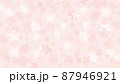 明るい桜の花びらと葉っぱと光の背景 87946921