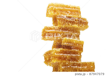 portions of fresh honeycomb on a white background. vitamin natural food. bee work product portions of fresh honeycomb on a white background. vitamin natural food. bee work product 87947079