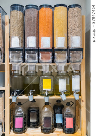 Shelf of organic food to refill in zero waste local shop. Refill station with organic food, oils, pastas Shelf of organic food to refill in zero waste local shop. Refill station with organic food, oils, pastas 87947454