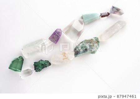 Set of healing minerals and crystal stones on white background. Flat lay of various gemstones and crystals Set of healing minerals and crystal stones on white background. Flat lay of various gemstones and crystals 87947461