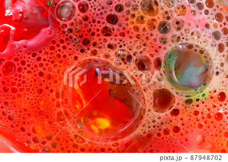 Texture pattern of soap bubbles on a red background. Texture pattern of soap bubbles on a red background. 87948702