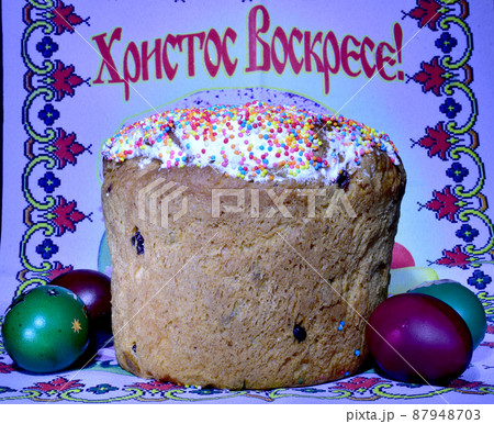Festive cake and colored eggs. 87948703