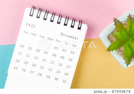 December 2022 desk calendar on multicolored background. December 2022 desk calendar on multicolored background. 87949678