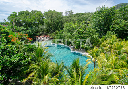 Swimming pool of Escape theme park in green tree. 87950738