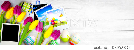 Easter background with colorful easter eggs on wooden background. 87952832