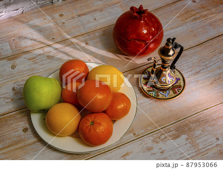 Still life with a Turkish jug, apples, lemons, tangerines and a vase in the shape of a pomegranate Still life with a Turkish jug, apples, lemons, tangerines and a vase in the shape of a pomegranate 87953066