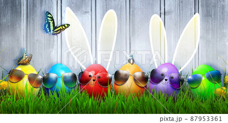 Easter background with colorful easter eggs on wooden background. 87953361