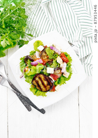 Salad of eggplant with cheese and tomatoes on white board top Salad of eggplant with cheese and tomatoes on white board top 87953446