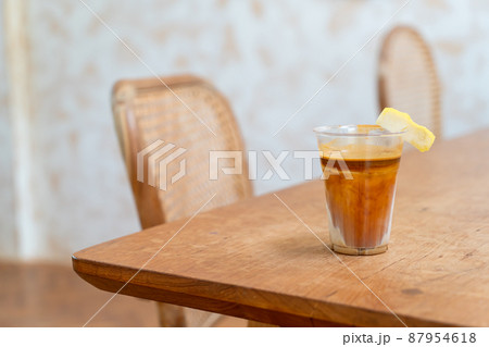 Specialty coffee menu called 'Dirty coffee' . Cold milk in the bottom with hot espresso shot on top Specialty coffee menu called 'Dirty coffee' . Cold milk in the bottom with hot espresso shot on top 87954618