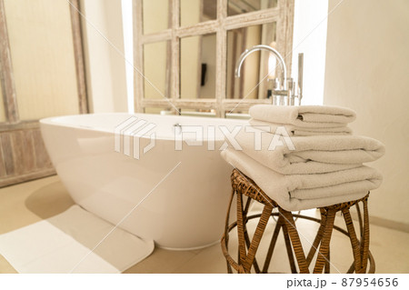 towel with bath tub in bathroom towel with bath tub in bathroom 87954656