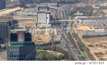Skyscrapers and other buildings near the Dubai World Trade center district in Dubai aerial timelapse 87957924