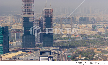 Aerial view of skyscrapers under construction in Dubai timelapse. Aerial view of skyscrapers under construction in Dubai timelapse. 87957925