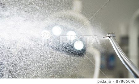Close the dental turbine with a water spray. Dentist equipment. 87965046