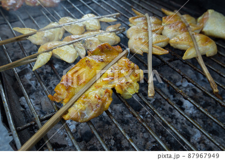 Thai Street Food, Charcoal Grilled roast Chickens on the grill. 87967949