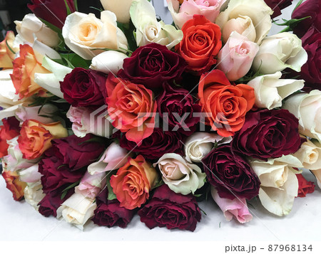 Close-up lying bouquet of multi-colored fresh roses 87968134