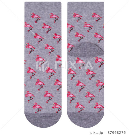 a pair of gray socks with a pattern of many pink flamingos, one sock lies on the front side, the other lies on the back side, isolate 87968276