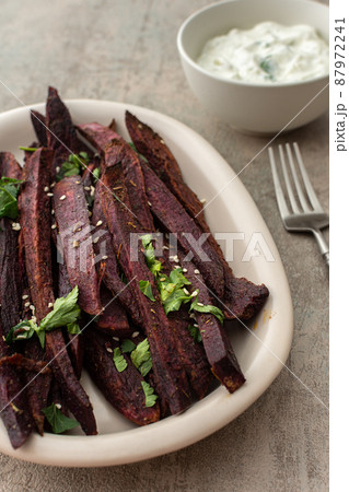 Oven baked purple sweet potato Oven baked purple sweet potato 87972241