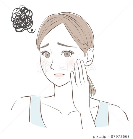 頬に手を当てて肌トラブルに悩む女性　　 87972663
