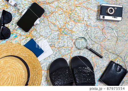 Travel plan, trip vacation accessories for trip, tourism mockup - Outfit of traveler on map background. Flat lay and copyspace. Travel plan, trip vacation accessories for trip, tourism mockup - Outfit of traveler on map background. Flat lay and copyspace. 87973554