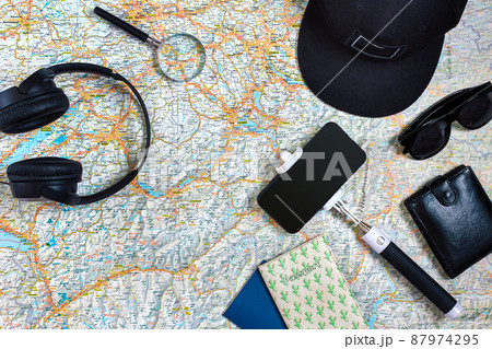 Travel plan, trip vacation accessories for trip, tourism mockup - Outfit of traveler on map background. Flat lay and copyspace. Travel plan, trip vacation accessories for trip, tourism mockup - Outfit of traveler on map background. Flat lay and copyspace. 87974295
