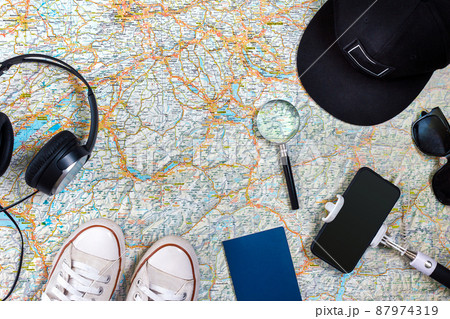 Travel plan, trip vacation accessories for trip, tourism mockup - Outfit of traveler on map background. Flat lay and copyspace. Travel plan, trip vacation accessories for trip, tourism mockup - Outfit of traveler on map background. Flat lay and copyspace. 87974319
