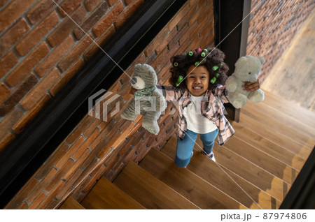 Top view of girl showing toys to camera Top view of girl showing toys to camera 87974806