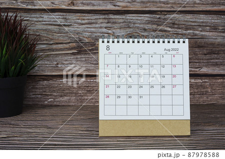 White August 2022 calendar on wooden desk. 2022 new year concept. White August 2022 calendar on wooden desk. 2022 new year concept. 87978588