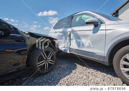 Cars crashed heavily in road accident after collision on city street. Road safety and insurance concept Cars crashed heavily in road accident after collision on city street. Road safety and insurance concept 87978696