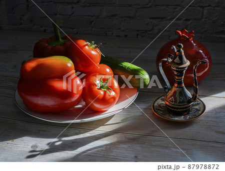 Still life with a Turkish jug, tomatoes, pepper, cucumber and a vase in the shape of a pomegranate Still life with a Turkish jug, tomatoes, pepper, cucumber and a vase in the shape of a pomegranate 87978872