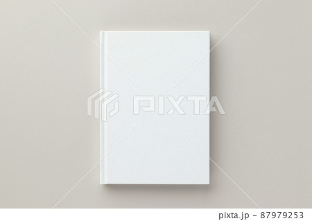 White book blank cover mockup on a beige background, flat lay, mockup 87979253