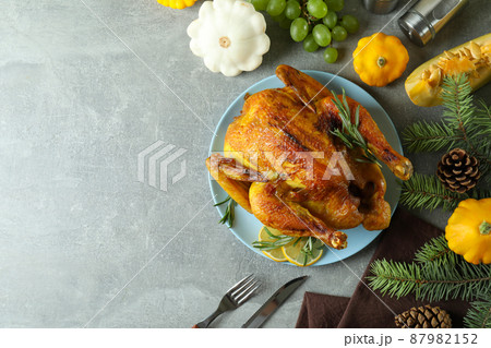 Thanksgiving Day roast turkey concept on gray textured table Thanksgiving Day roast turkey concept on gray textured table 87982152
