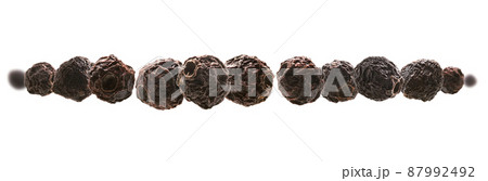 Dried hawthorn berries levitate on a white background Dried hawthorn berries levitate on a white background 87992492