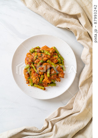 Stir fried pork and red curry paste with sting bean Stir fried pork and red curry paste with sting bean 87993242