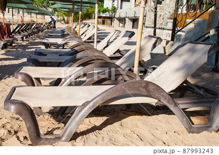 Beach chairs with umbrella outdoor swimming pool on the beach. Beach chairs with umbrella outdoor swimming pool on the beach. 87993243