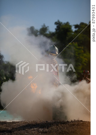 Firefighter with fire and suit for protect fire fighter for training firefighters. 87993431
