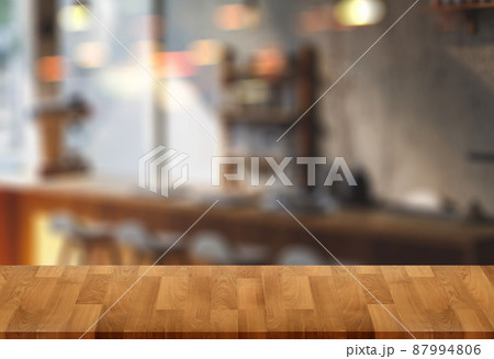 Wood table with blur in coffee shop cafe For montage product display table copy space cafe background with copy space for text Wood table with blur in coffee shop cafe For montage product display table copy space cafe background with copy space for text 87994806