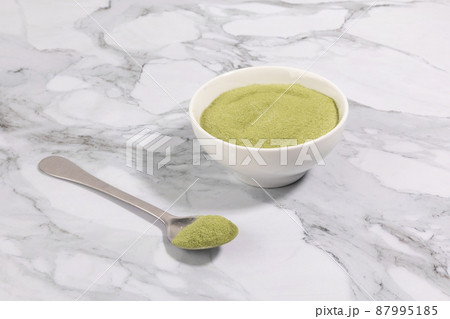 matcha green tea powder powder in a white bowl matcha green tea powder powder in a white bowl 87995185
