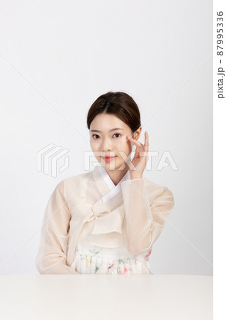 Asian Korean young woman wearing Hanbok Korean traditional clothes, beauty concept in studio 87995336