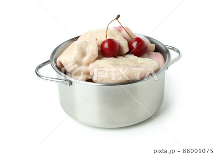 Pot with pierogi with cherry isolated on white background 88001075