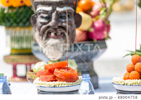 Divine offerings in Hinduism. Offer the sacrifices such food, tea and spirit to the ancestors 88004758