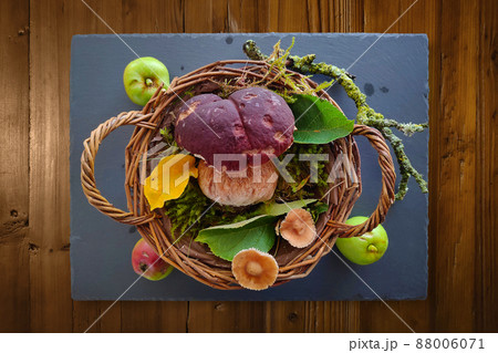 Boletus in a wicker basket on a slate Boletus in a wicker basket on a slate 88006071